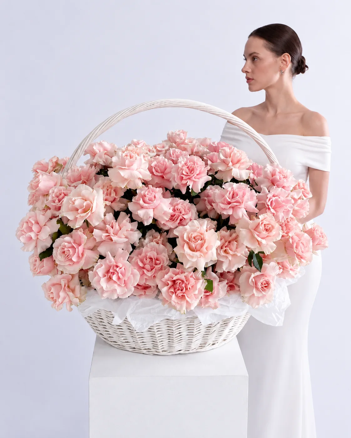 A luxurious, oversized bouquet of mixed peonies and roses displayed in a bright Dubai penthouse.